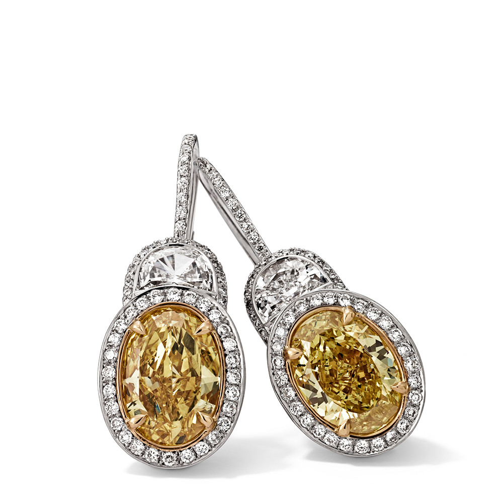 Ohrringe in 750 Weißgold und Gelbgold mit Fancy Intense Yellow und weißen Diamanten.